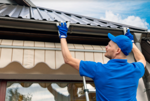 roofing contractor installing metal roof